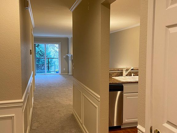Entry hall with pass through to living area and kitchen on the right