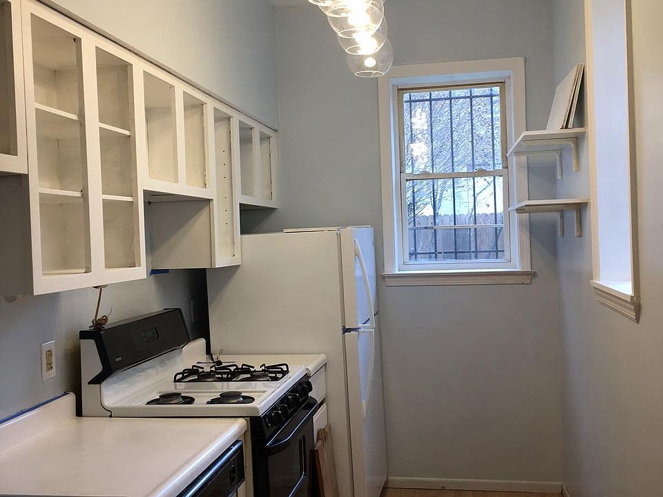 Cook in this galley kitchen that opens to dining room