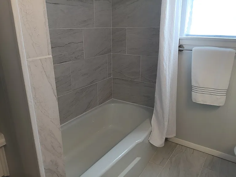 Central bath tub-shower combo