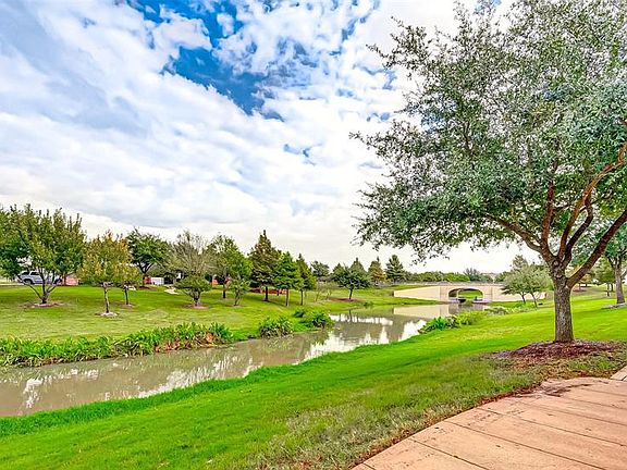 Walking trail just steps away from the home adds this beautiful nature at your front door!