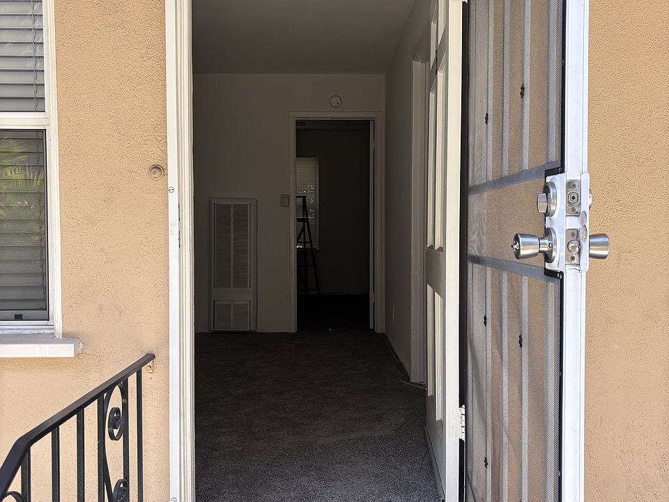 Door to #3 - Security screen door and wooden door