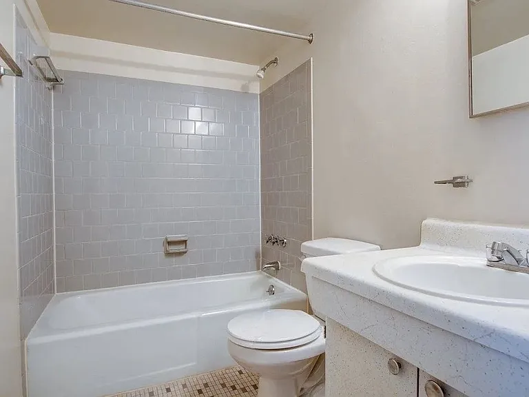 Large bathroom with subway tiled shower