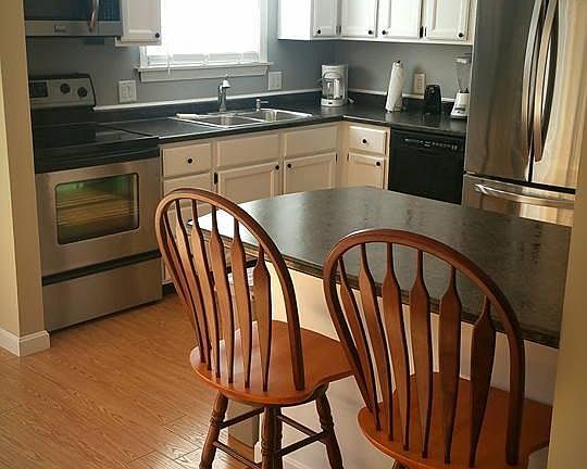 Kitchen with stainless steel appliances.