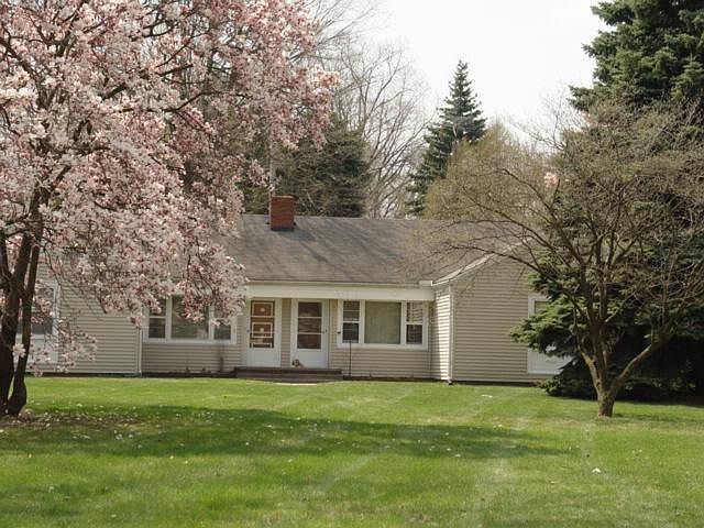 Front of Property with Dogwood Trees in Bloom