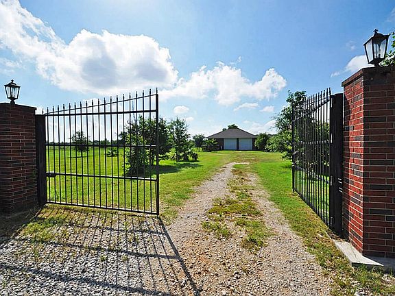  Gated main entrance to property