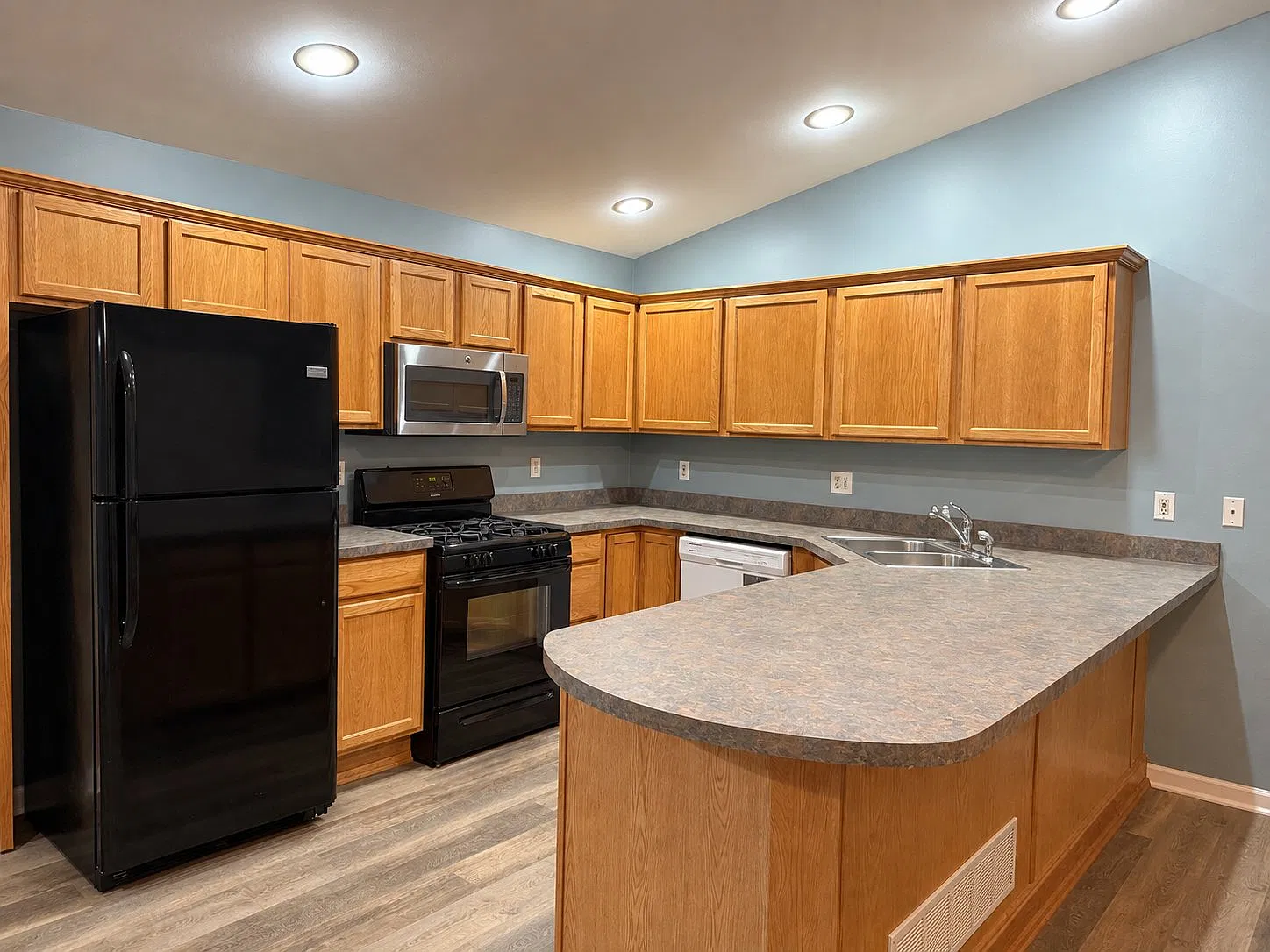 Renovated 4-Bed, 2-Bath Duplex with Large Attached 2-Car Garage | Near Lakes & Downtown — Photo 2