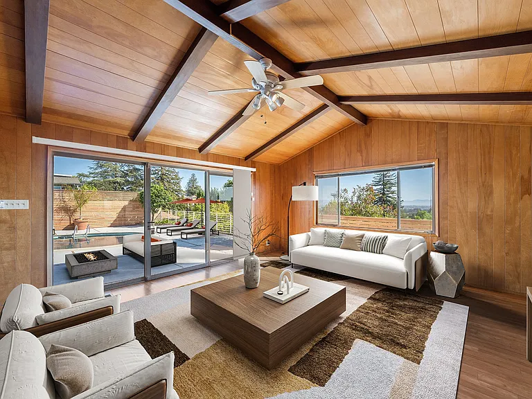 Virtual Staged Family Room that opens to the pool area.