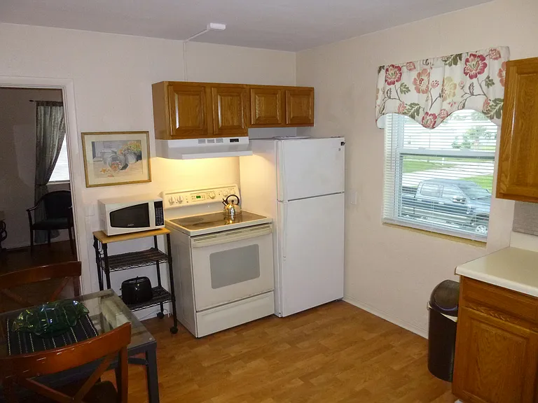 Complete Eat-in Kitchen with Stove, Refrigerator, Microwave, Toaster, 
Coffee maker, Tea Pot, Utensils