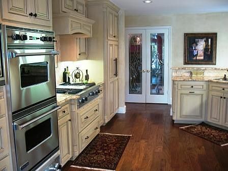 Custom stained glass french doors lead to diningroom and livingroom.