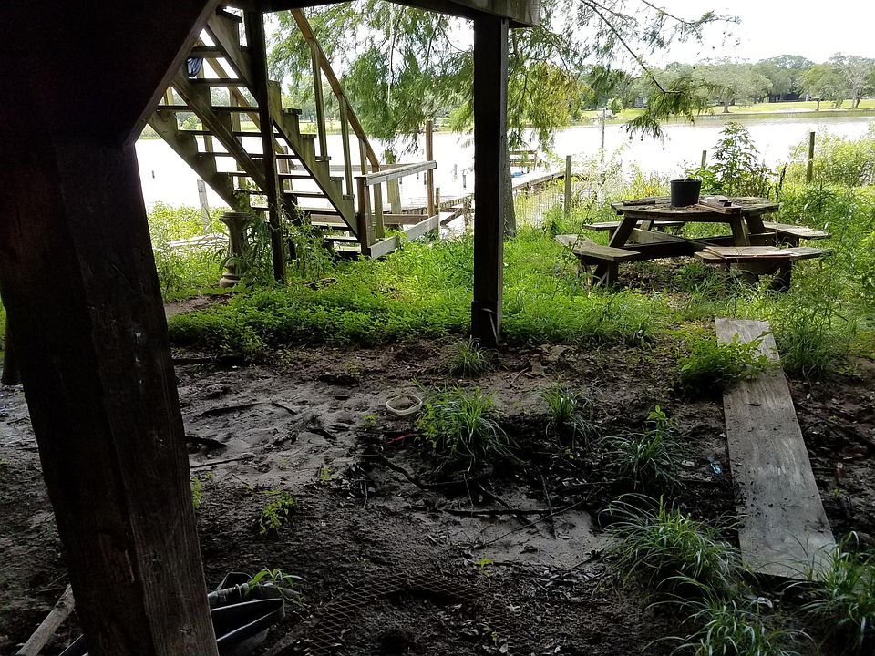 Deck going out to the Boat Dock grass beeds mowing and boar