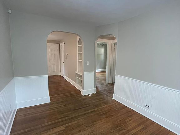 Dining room with beautiful archway leading to living room & bedrooms