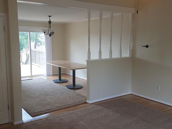 Dining area. Custom table can remain if you like. 