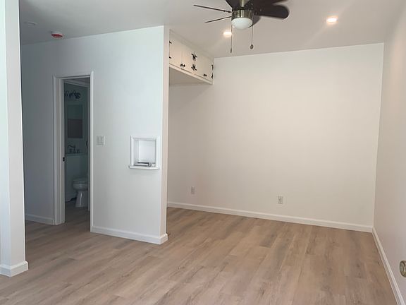 Studio looking at back side, lots of storage on top and plenty of electric outlets for folks who work at home.