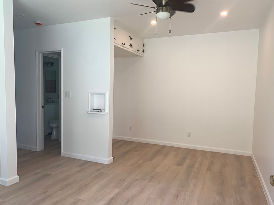 Studio looking at back side, lots of storage on top and plenty of electric outlets for folks who work at home.