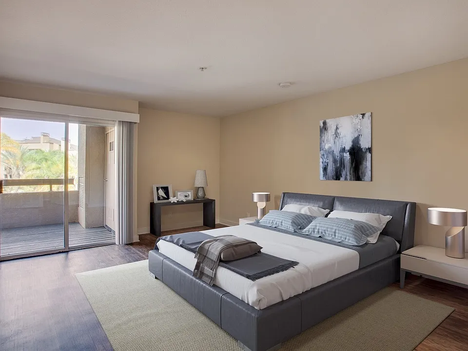 The spacious master bedroom features accent wall and private bathroom