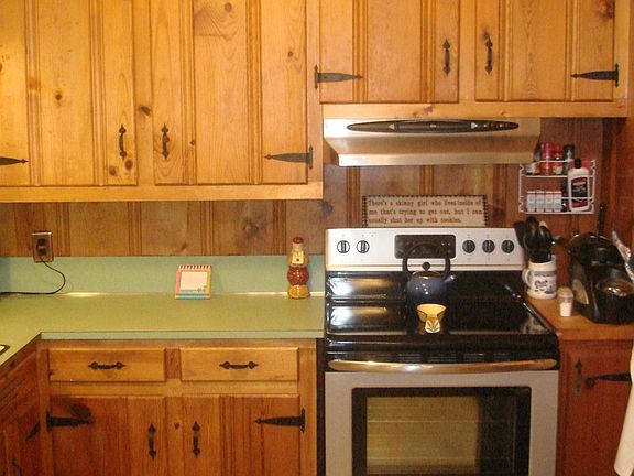 Increasingly hard to find custom built knotty pine cabinets.