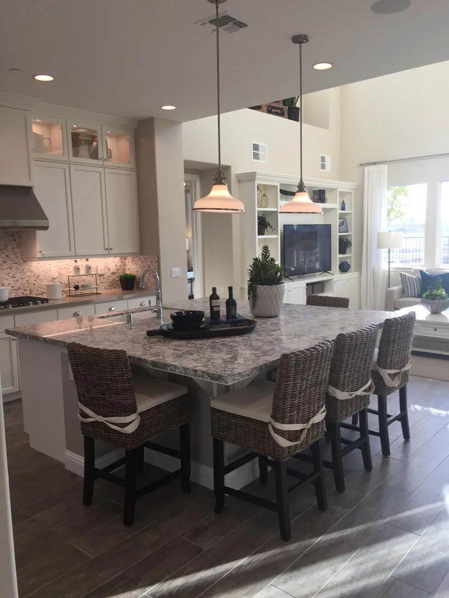 Photos of interior of home from model. Extra large granite kitchen island, etc., in actual home as well. - 596 Bluffs Dr