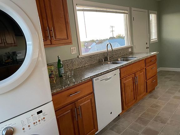 Washer and dryer in kitchen for your convenience. Picture window brings in natural lighting.