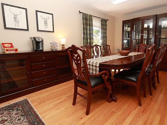 Dining area attached to the living room in an open setting.