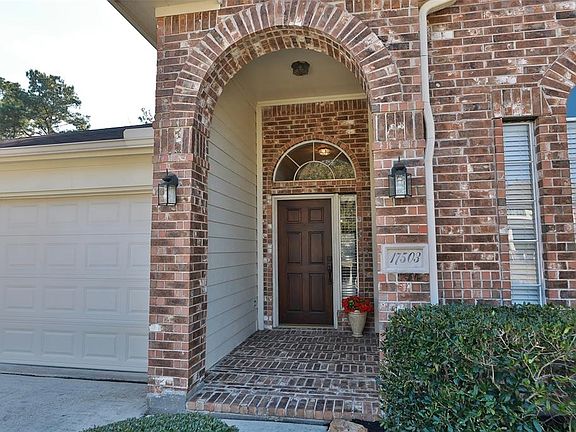 Solid wood front door with side light window.
