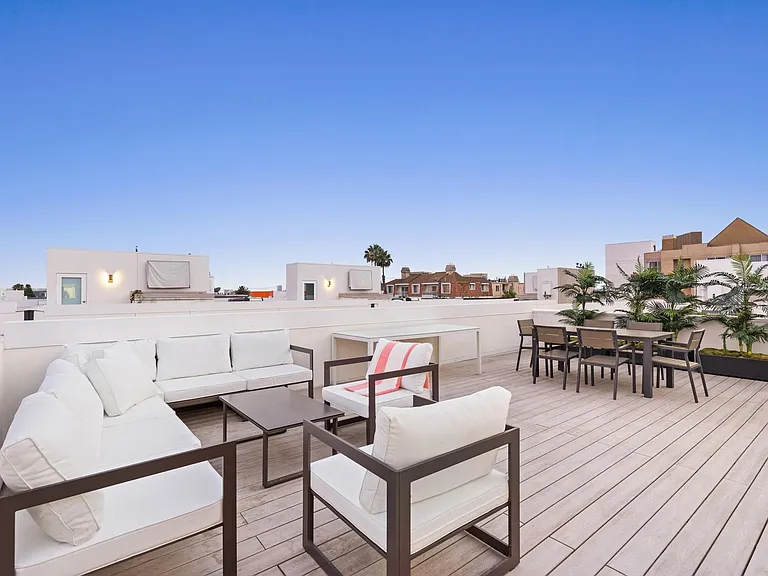 Rooftop views with plush outdoor seating and dining space
