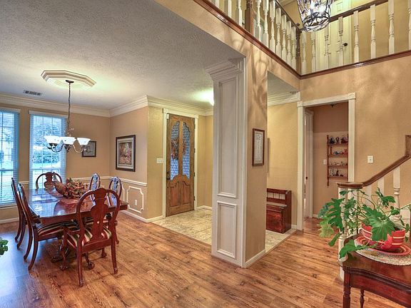Beautiful warm yet neutral colors, rich wood trim and high ceilings.
