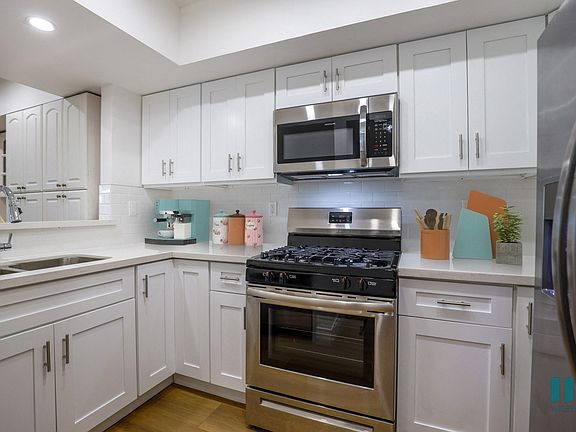 Kitchen with Energy-Efficient Appliances and Ample Cabinet Storage
