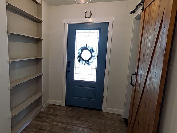 Custom built ins and barn door in foyer