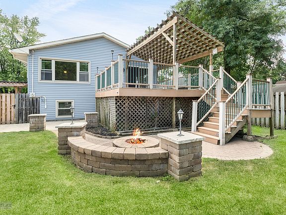 Amazing backyard oasis with 2nd story deck, paver patio and firepit
