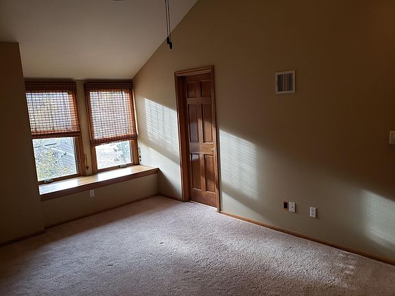 Master bedroom with vaulted ceiling