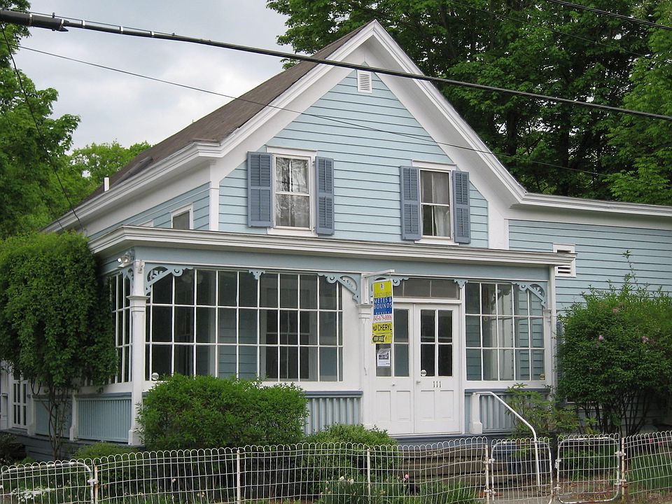 Exterior with glass enclosed front porch