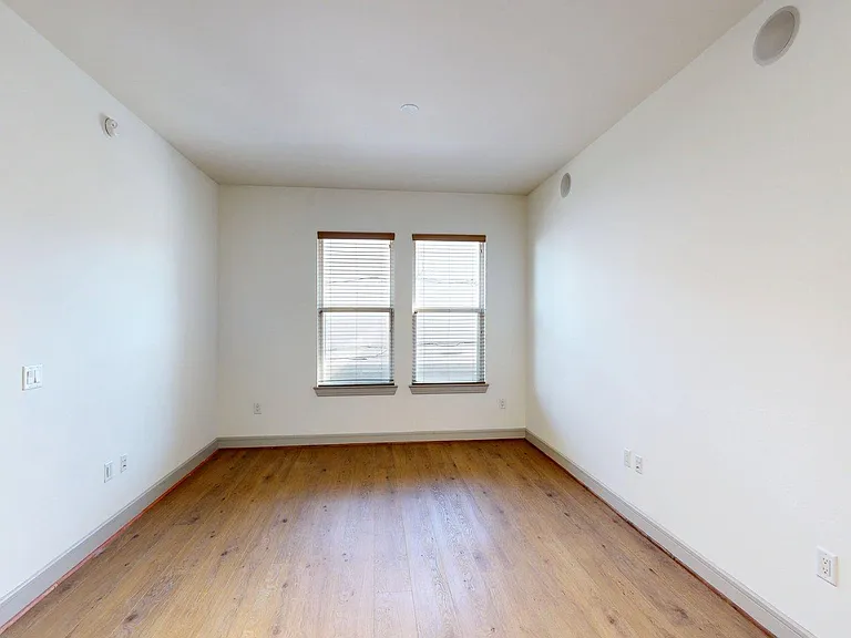 Apartment Living Room with Wood Style Flooring.