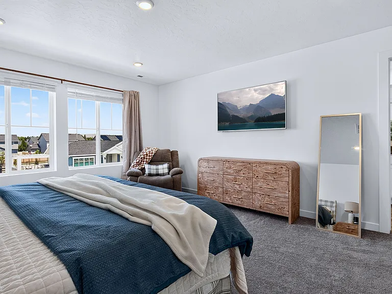 Master Suite with 60" Smart TV & Reclining Rocking Chair