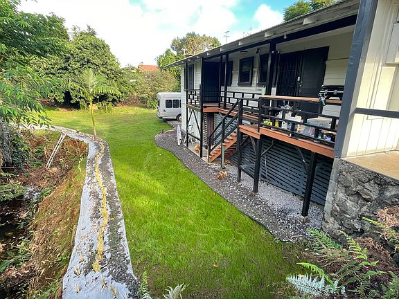 Looking down to the yard from the street