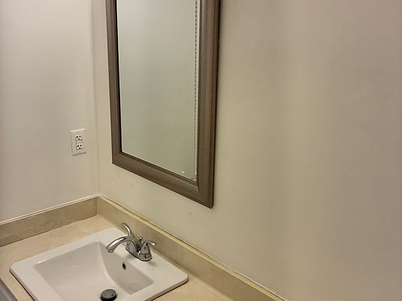 Guest half bath off the entrance