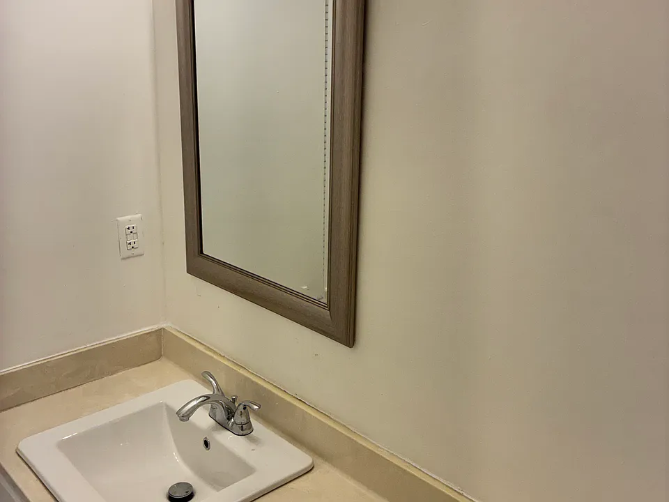 Guest half bath off the entrance