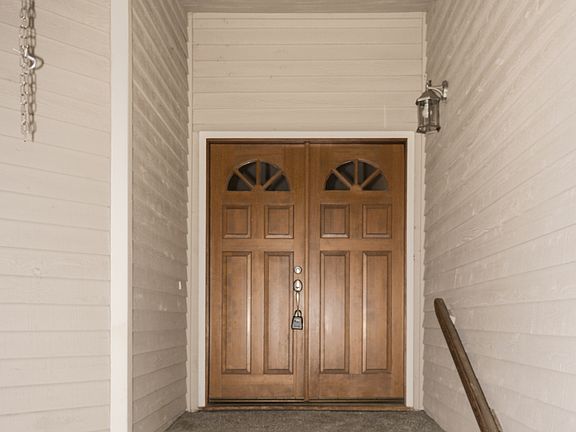 Welcoming Entrance with Beautiful French Doors
