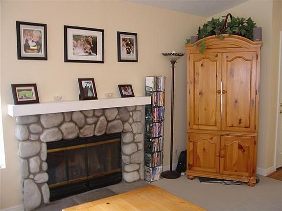 Rock fireplace in the living room is welcoming!