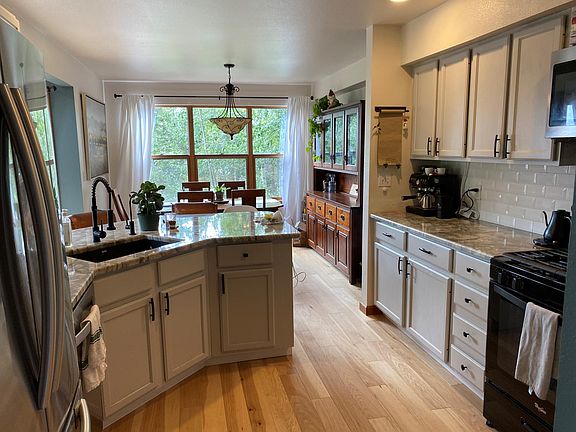 Newer (2021) granite countertops, cabinets, dishwasher and fridge