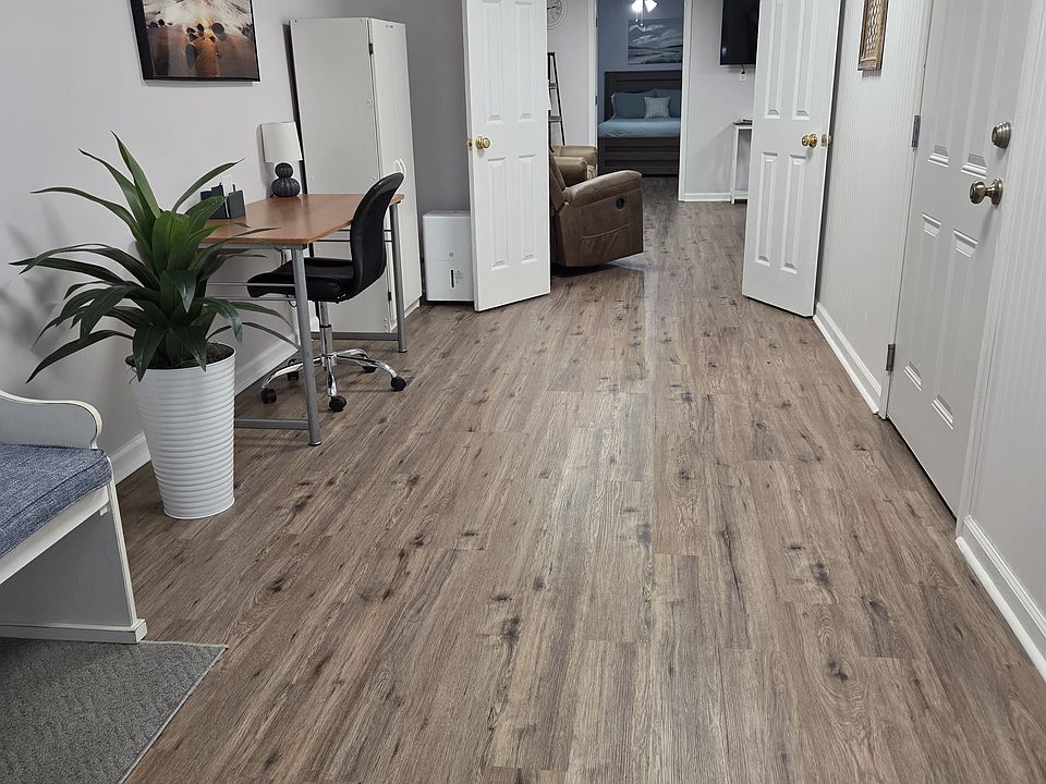 Entryway with LVP floors, Bench, desk and storage closet