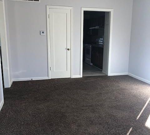 living room from front door. Coat closet.