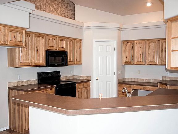 Kitchen with Plant Shelves