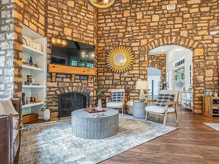 Relax in the cozy, rustic clubhouse at The Cottages of Hattiesburg.
