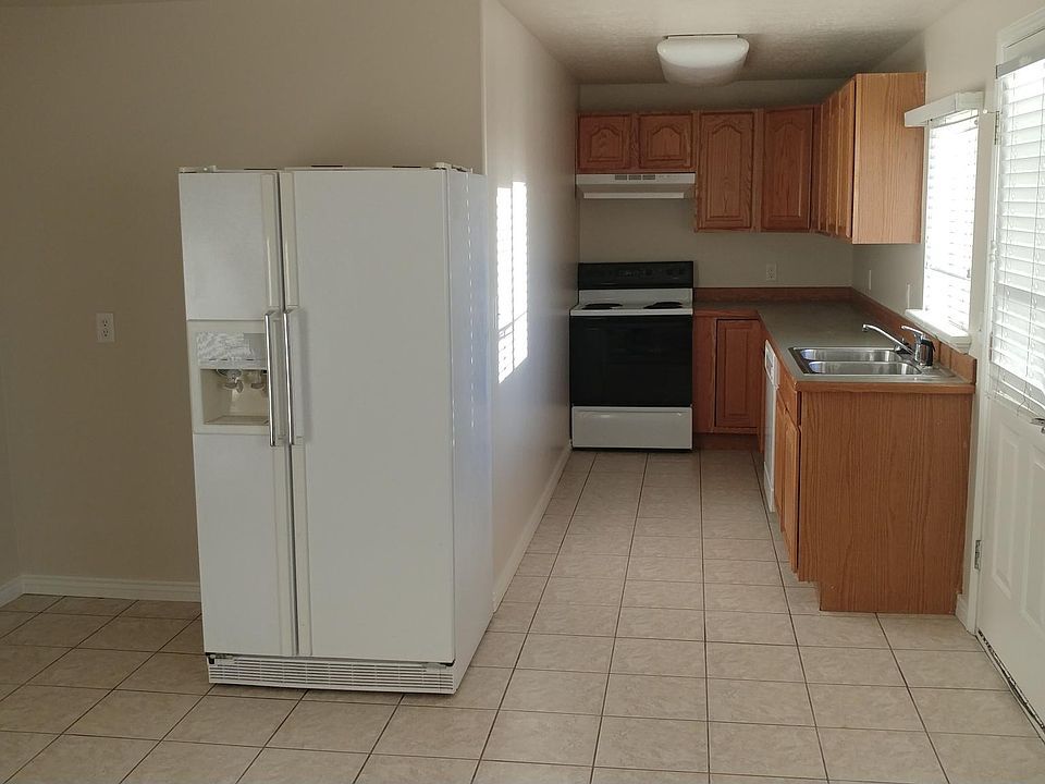 Kitchen/Entry main level lighting and entry door to outside