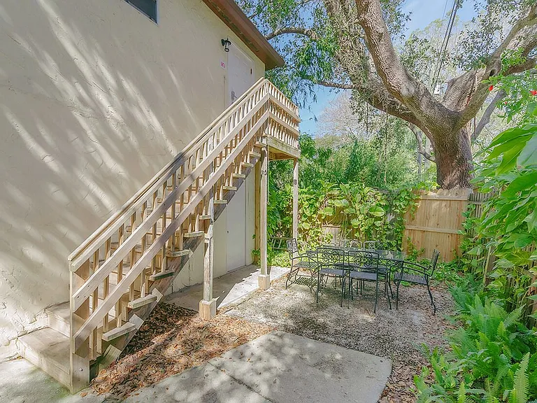Stairs to Unit A | Covered Bike Storage | Private, Shaded Outdoor Dining/Seating Area