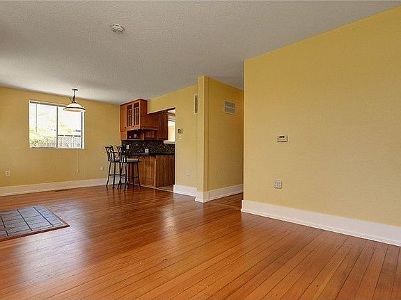 Another view of the front entry, living and dining areas and the breakfast bar.