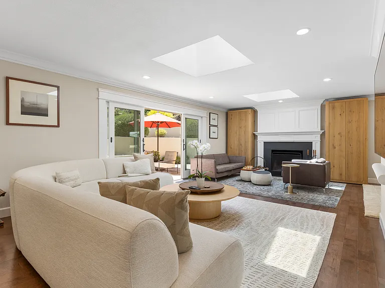 Extra spacious living area with two seating areas and french sliding doors to the living room terrace