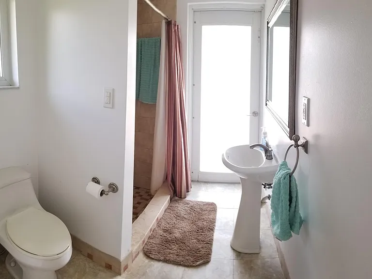 Bathroom with secondary access to the deck and yard