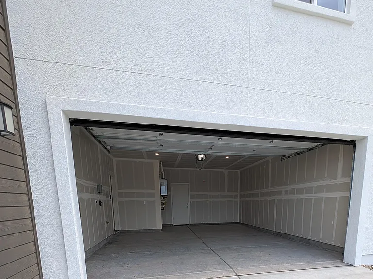 Garage with tankless water heater and EV charging port