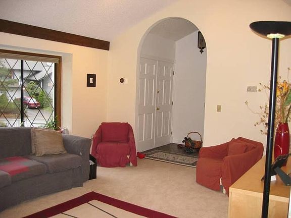 Hardwood floors in the living room and new tile in the entry